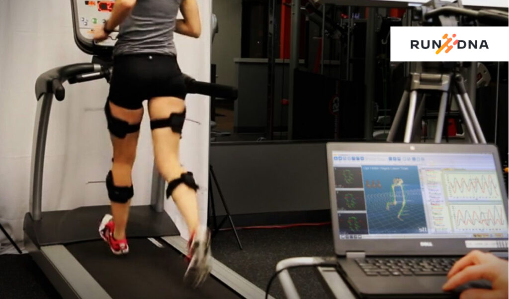 Physical therapist conducting video analysis of patient's running mechanics.