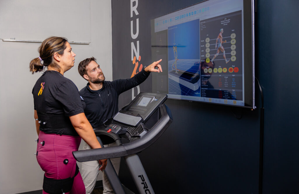 Physical therapist reviewing walking gait biomechanical data with patient.