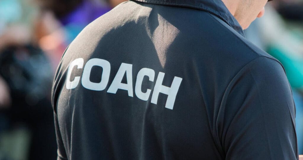Running coach guiding athletes